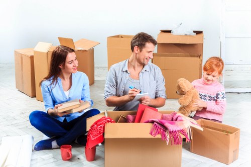 Loading furniture into a removal van in Staines