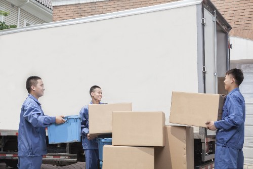 Removal team planning a home move in Staines with boxes and furniture