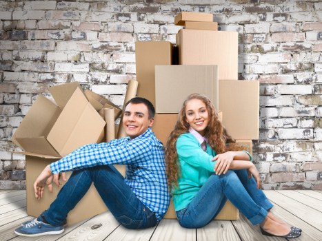 Packing boxes and furniture being loaded for a Staines house move