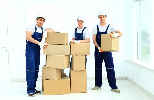 Packed boxes and furniture ready for loading into a removals van