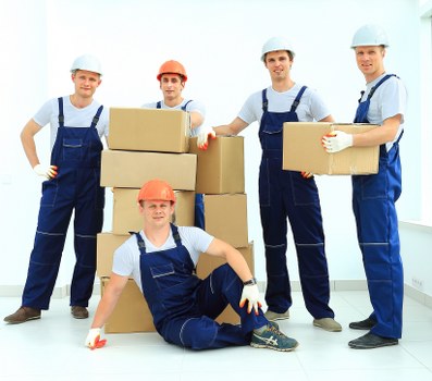 Professional movers loading a van for a Staines relocation
