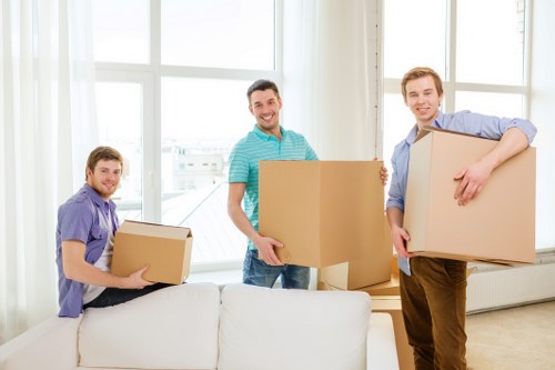 Organised office move with labelled crates and equipment handling in Staines