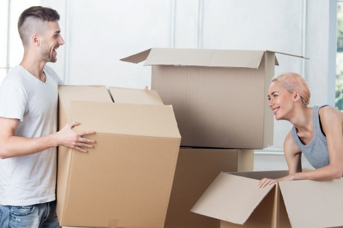 Local movers packing boxes and fragile items in Staines