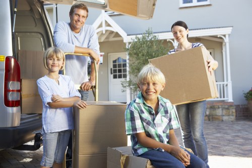 Loading household furniture into a moving truck in Staines