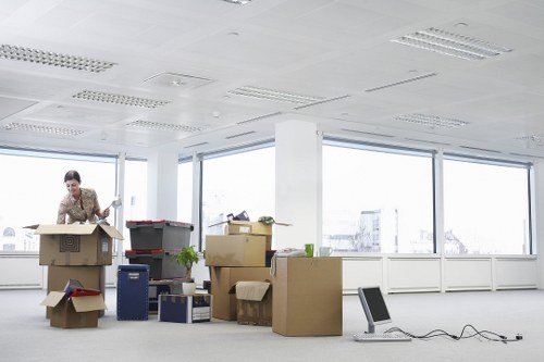 Local removals crew handling household furniture with care