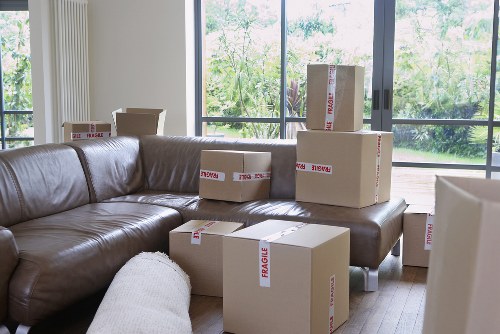 Local moving van loading boxes and household items in Staines