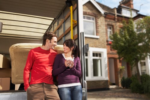 Packed boxes and furniture prepared for a residential move in Staines
